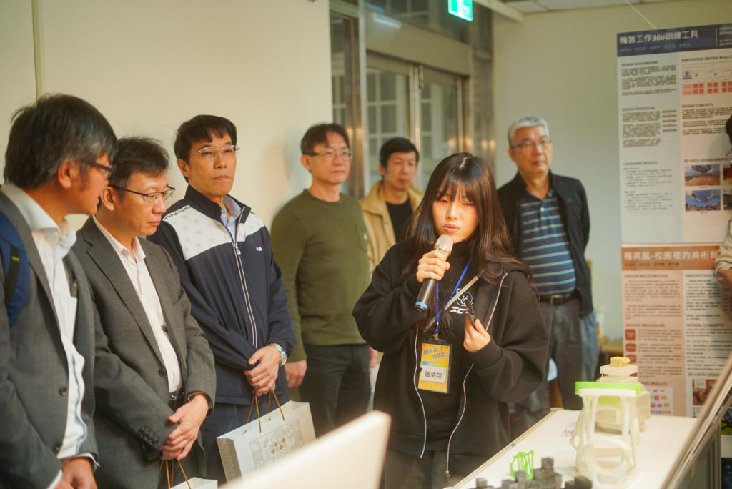 A student presenter introduces her interdisciplinary project at the NYCU 2025 ICT OPEN LABS exhibition, as faculty members and visitors observe demonstrations that showcase hands-on learning and cross-disciplinary collaboration.