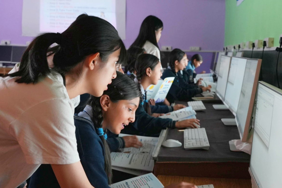Students from the Jullay Team share introductory Python programming lessons with students at Rigjung Public School.