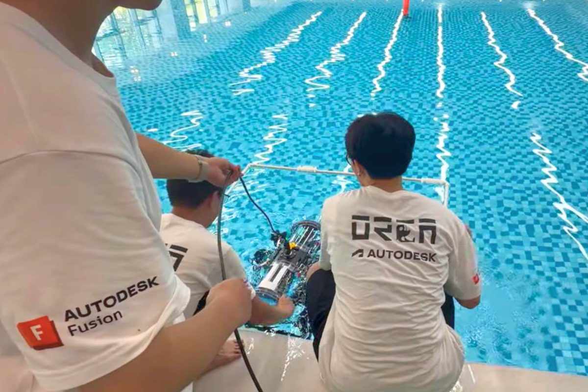 The ORCA AUV Team prepares and deploys their autonomous underwater vehicle during the 2026 SAUVC, conducting final system checks before competition missions in the pool-based test environment.