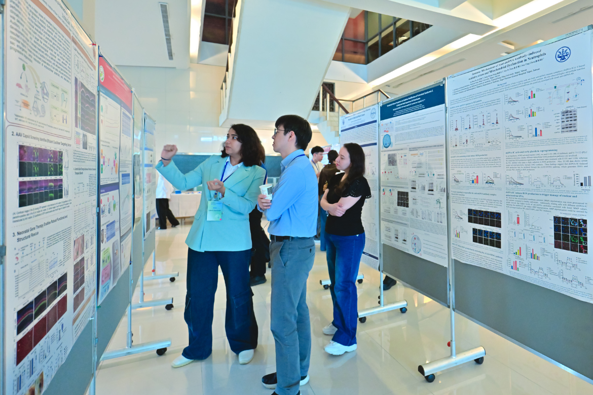 Students present their research during the symposium’s poster competition, engaging with scholars and experts across diverse fields of medical science.